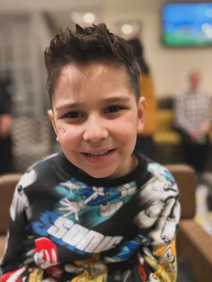 A happy client with his fresh new haircut. It's always my goal to make sure the kids have a great experience and leave with a smile.