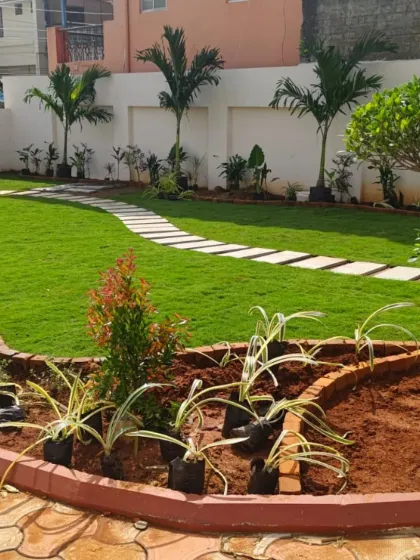 This recently completed residential garden shows our core services in action. We installed a lush, healthy lawn, laid a clean stone pathway, and planted a variety of shrubs and trees to create a simple yet beautiful outdoor living area.