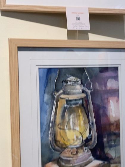 A close-up of my framed 'Nostalgia' lantern painting at the Art Bengaluru exhibition, complete with the QR code for details.