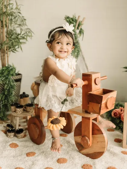 A bright, happy smile from this little girl during her first birthday studio session.