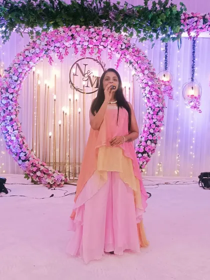 On stage at Mamta and Nikhil's ring ceremony. The beautiful floral ring decor provided a perfect setting for their commitment to forever.