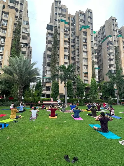 A wide shot of our International Yoga Day celebration in the park. It is a powerful experience to practice and breathe together as a large community, united by the shared path of yoga.