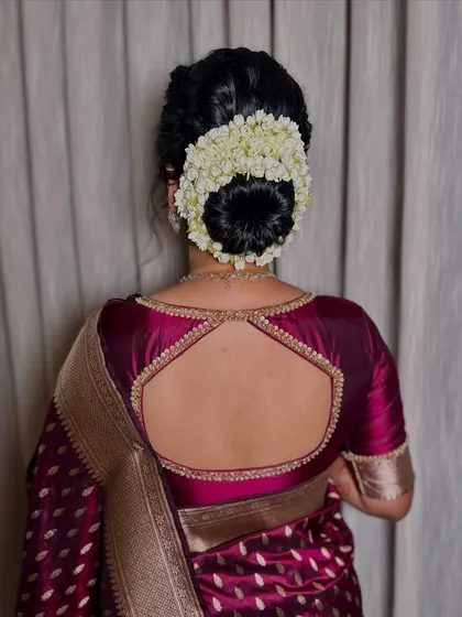 A full and lush gajra bun made with fresh jasmine flowers. The fragrance and beauty of this hairstyle are unmatched for a traditional wedding.