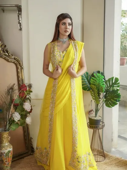 Radiant in yellow for a Haldi or Mehendi function. The makeup is kept clean and bright to complement the sunny color of the outfit.
