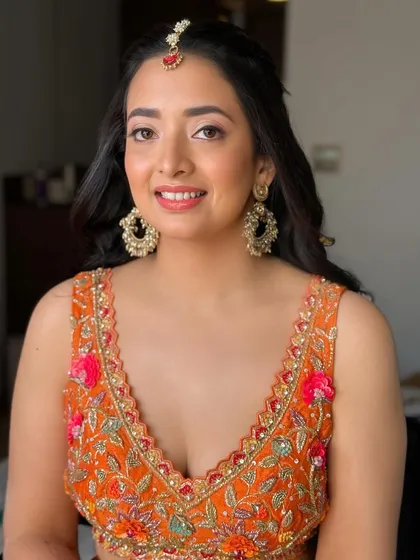 Another beautiful portrait of our Haldi bride. Her smile is infectious, and her makeup is designed to enhance her natural joy.