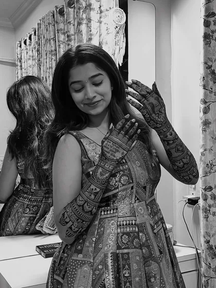 A beautiful black and white photo of Shrutika, which gives her mehendi a timeless and classic feel.