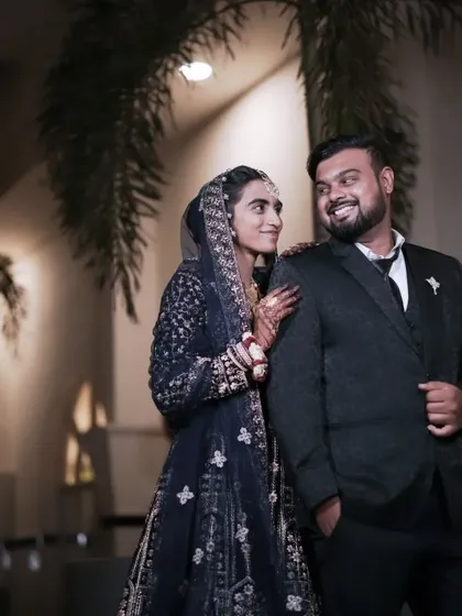 An elegant reception portrait under the stars. We excel at night photography, using professional lighting to capture the glamour and intimacy of your post-wedding celebrations.