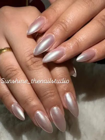 A simple and elegant set of long, almond-shaped chrome nails.