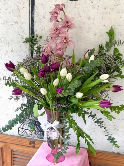 A beautiful shot of one of my favorite vase arrangements, featuring a mix of tulips and orchids. This is the kind of floral design that makes any day feel special.