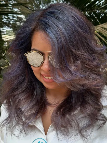 For my experimental clients like Bhakti, we love to play. This time we went for a cool purple and blue mix on her curly hair. The color looks so different after a few washes, fading into a beautiful pastel tone.