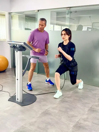A lunge variation during Manushi Chhillar's EMS workout. This cutting edge training is a smart way to build functional strength and endurance without spending hours in the gym.