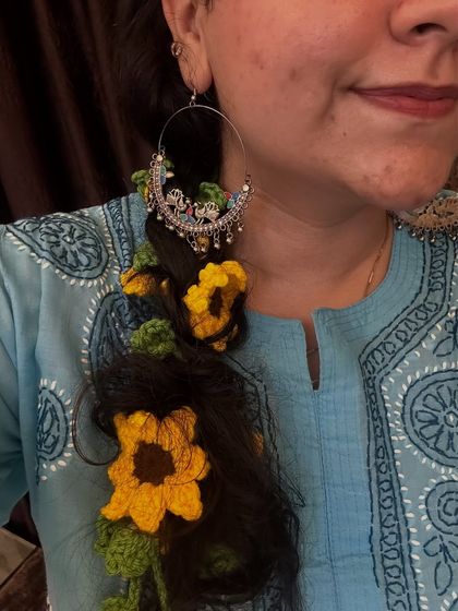 A close-up of my sunflower parandi, styled with a beautiful traditional earring. This shows how you can mix and match accessories for a complete festive look.