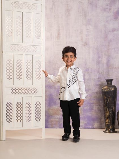 A full length view of the custom ant embroidered shirt. This piece is a perfect example of how I can bring a unique and personalized idea to life for a special birthday outfit.