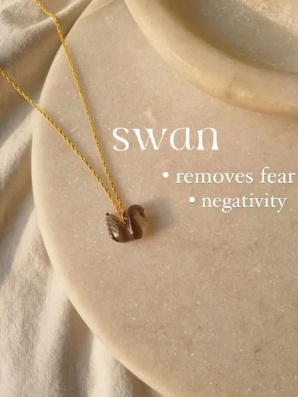 Another view of the smoky quartz swan pendant, a stone that helps neutralize negative vibrations.