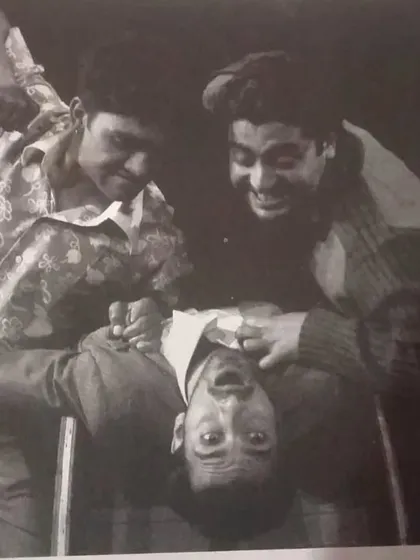 A throwback to our director Mr. Binod Sharma's work as an actor in the NSD Repertory Company. This black and white photo captures a moment of intense physical comedy.