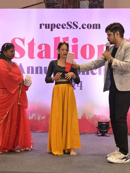 Leading an interactive game with participants on stage. These segments are perfect for breaking up formal proceedings and injecting a dose of fun into the evening.
