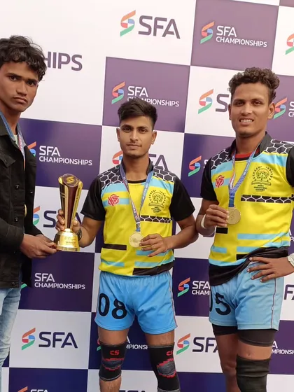 Three of my champion athletes posing with their Gold medals and trophy after a commanding performance at the SFA Championships.