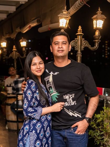 A couple enjoying the rooftop ambiance.