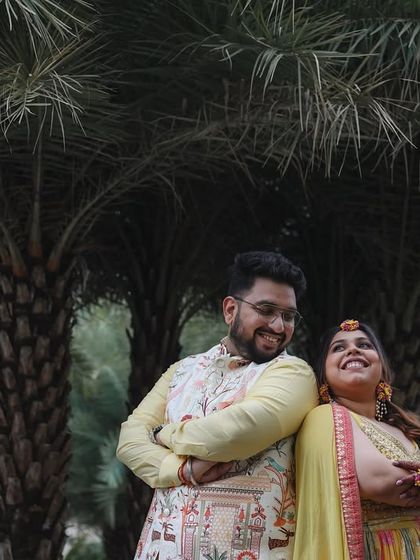 A sweet and relaxed portrait of the couple during their Haldi event, taking a quiet moment together amidst the fun.
