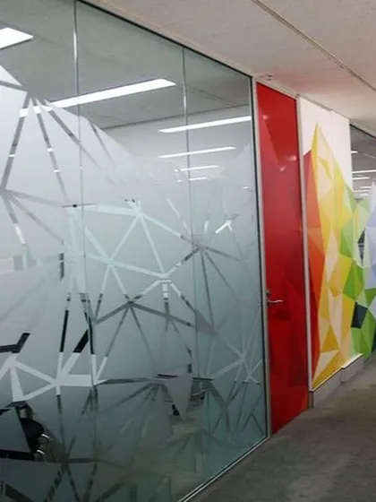 This geometric frosted glass film adds a modern, professional look to an office space. It provides necessary privacy for meetings while enhancing the interior design with a sharp, contemporary pattern.