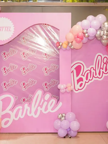 A life-sized Barbie box photo booth, a popular feature at our Barbie-themed parties. It's a fun and interactive element that guests of all ages love.