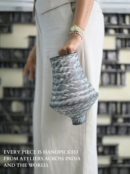 The connection to a piece is often felt through touch. Here, you can almost feel the unique, feathered texture of this handpicked vase. It represents our commitment to curating objects from ateliers across the world that are not just seen but experienced, each with its own story of craft and culture.