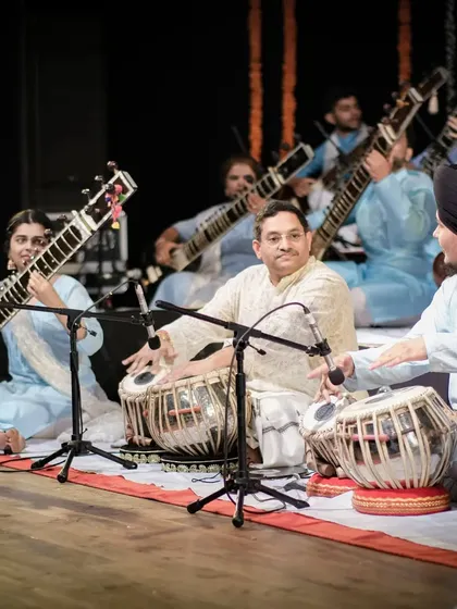 Another angle from the Sitar Symphony, showing the beautiful synchronicity of so many sitars playing together, supported by the rhythm section.