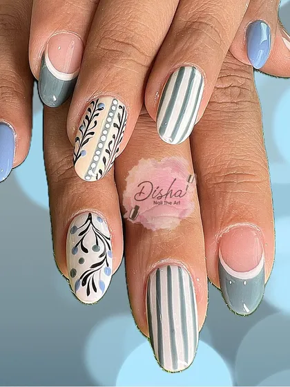 A full look at this beautifully detailed set. The combination of hand-painted botanicals, stripes, and French tips in a soft blue-grey palette is simply stunning.