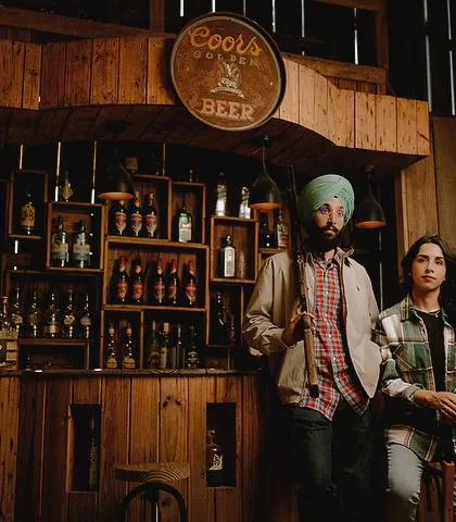 Posing in a rustic, old-school bar set, Manpreet and Simran look like characters from a movie. Themed sets like this are a great way to have fun and create a unique pre-wedding album.