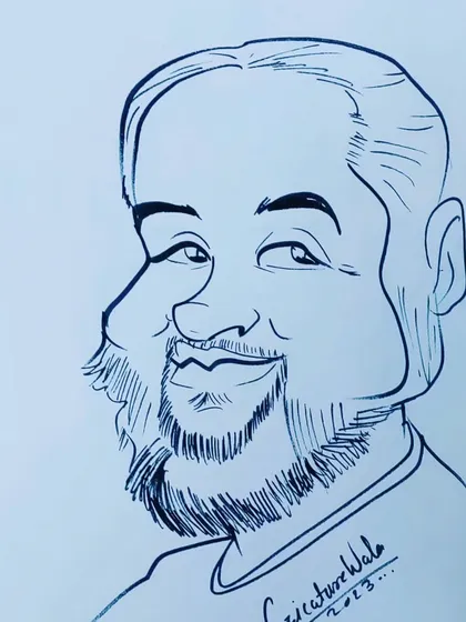 A friendly-looking man with a beard. I enjoy capturing the warmth in people's smiles.