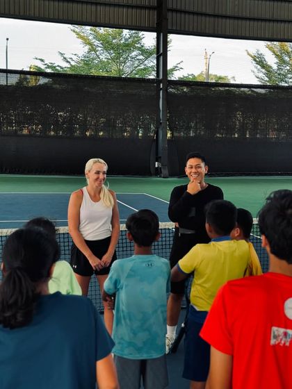 Our young players listen intently during an interactive session with a professional athlete. We create an environment where students can ask questions and learn directly from their idols.