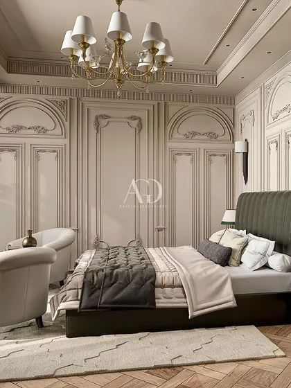 I designed this retreat to reflect opulence and luxury with exquisite detailing. The tall, channel-tufted headboard in dark leather makes a bold statement against the intricately paneled walls.