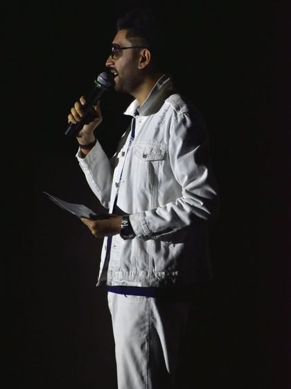 Anchoring isn't just about being in the spotlight; it's about being the spotlight. In the dark, a host's voice and presence must be enough to energize the room.