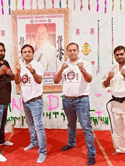 The examiners in a fighting stance. We are all karatekas at heart, united by our love for Kyokushin.