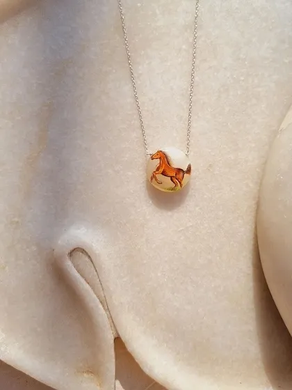 A final, beautiful shot of the "Oliver's Horse" hand-painted pendant.