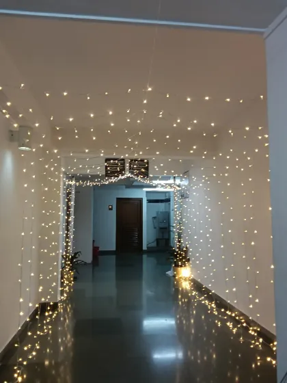 The fairy light entranceway for the engagement ceremony, glowing warmly and creating an enchanting atmosphere for the event.