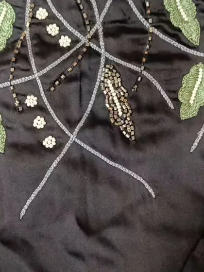 Another look at the beautiful hand-embroidery. Each piece is customizable to fit your personal style.