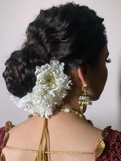 Shubhangi's wedding photos. I created a soft, romantic look with a messy braided bun and flawless makeup that lasted all night.