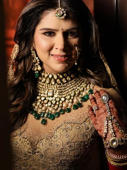 A beautiful bride with her hair in soft waves, a perfect look for her wedding day.