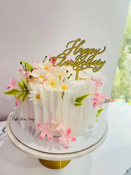 Celebrating life’s sweetest moments with an elegant wafer paper and floral anniversary cake.