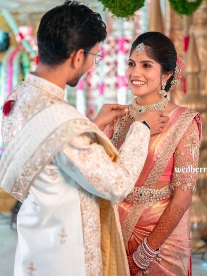 This bride's pastel pink engagement saree is pure elegance. The professional photos highlight how the drape complements the decor and the couple's style, looking perfect from every angle.