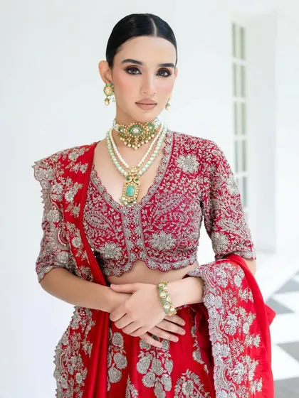 Another angle of this stunning Jayanti Reddy creation, focusing on the V-neck blouse and the exquisite layered jewellery. The styling is clean and elegant, letting the craftsmanship speak for itself.