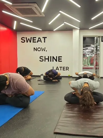 Students in Balasana (Child's Pose). This restorative pose gently stretches the lower back and hips, promoting relaxation and calming the nervous system.