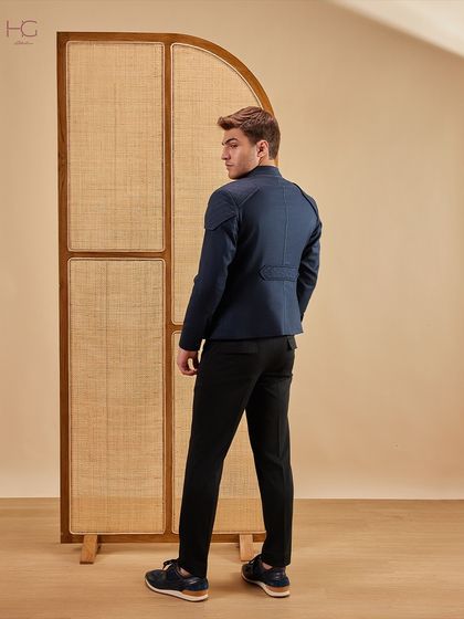 The back view of the navy zip-up shacket, showing its clean lines and tailored construction for a modern and polished silhouette.