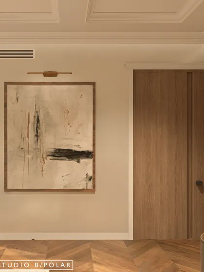 A detail of the artwork and flush wooden door in the master bedroom. The design philosophy is one of minimal, layered sophistication, with a focus on high-quality materials and finishes.