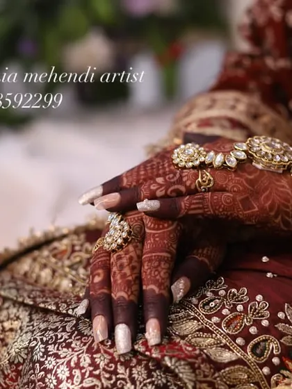The final stain on a bride's hands, adorned with beautiful jewelry. The color is deep and rich, just as it should be.