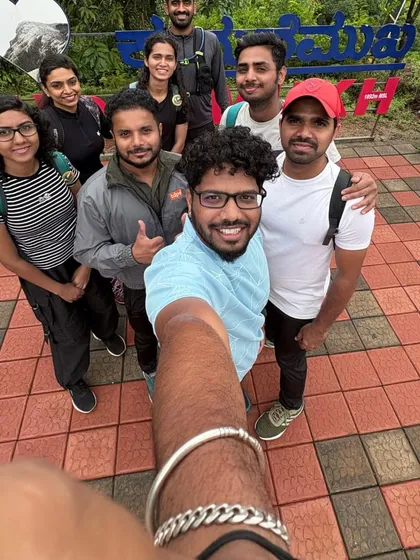 A fun group selfie at the "I Love Kudremukha" sign, a popular photo spot before starting the trek.