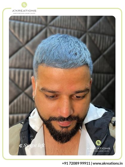 Men's hair coloring is about precision and style. This client chose a bold icy blue, which we paired with a sharp fade for a modern, edgy look.