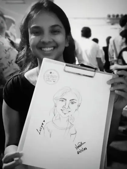 Another black and white shot. The focus is purely on her happy expression and her new piece of art.