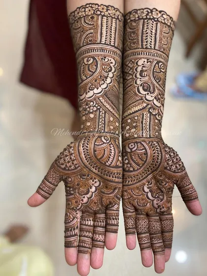 A classic and intricate mehendi design. The patterns are a mix of traditional Indian motifs, creating a timeless and elegant look.